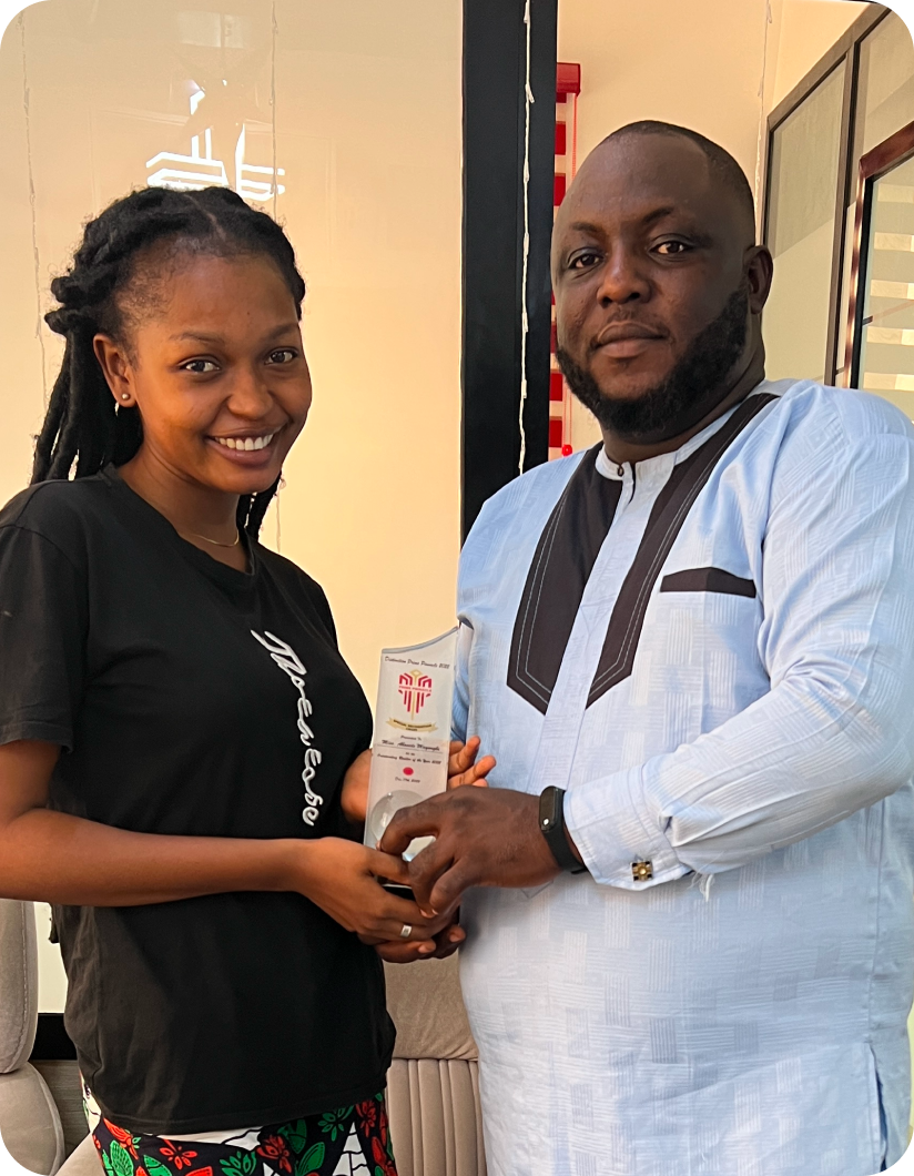 Bose May receiving an award